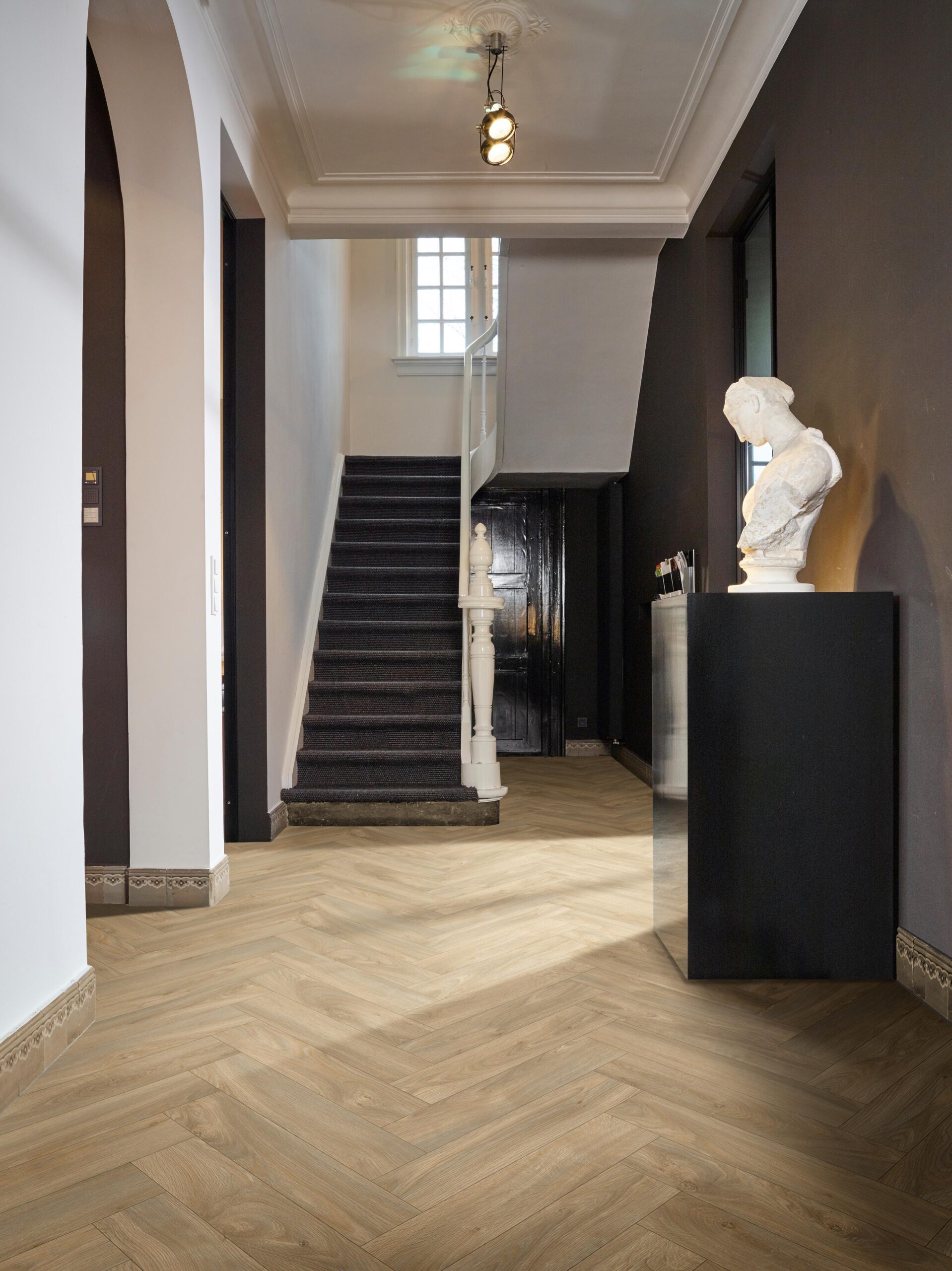 Dasos Sheet Vinyl – Oak Herringbone in a hallway