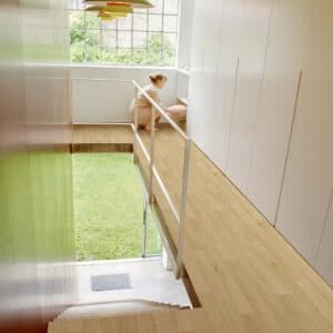 Juno Sheet Vinyl – French Oak in a hallway