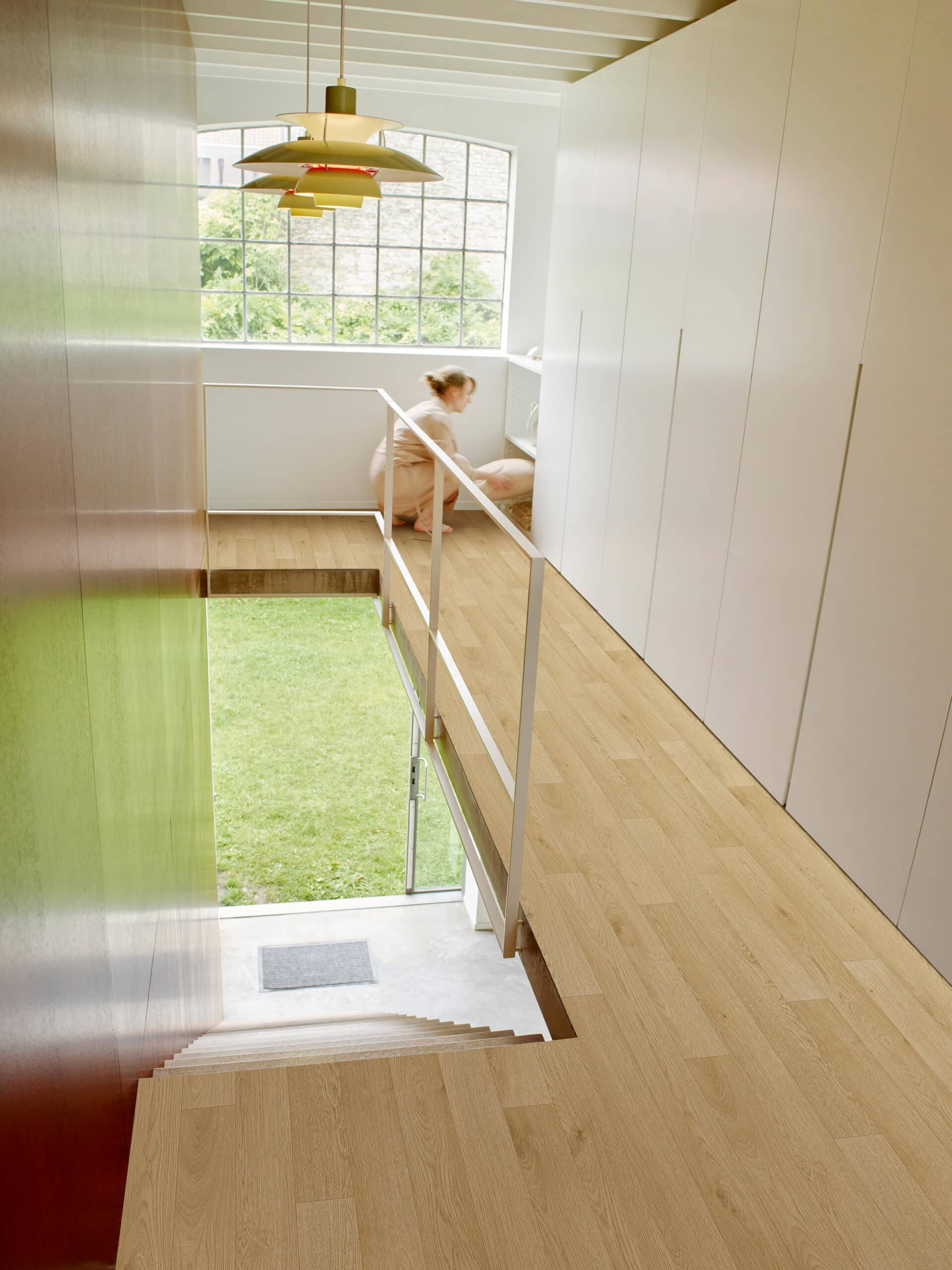 Juno Sheet Vinyl – French Oak in a hallway